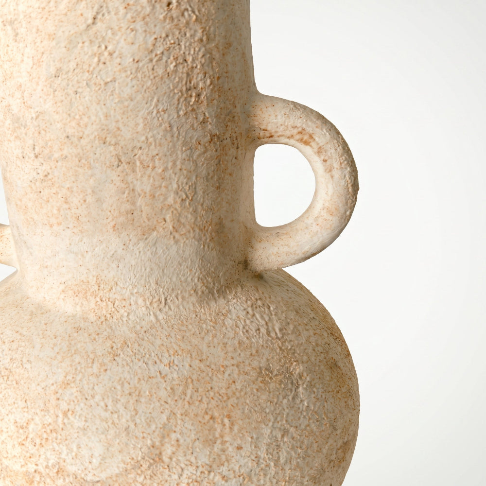 An extreme macro profile shot focusing on the attached loop handle and the coarse, gritty sand-like weathered texture of a rustic wabi-sabi ceramic vase by Kove Ceramics.